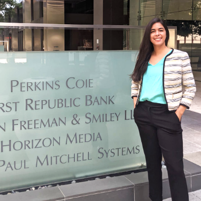 Elissa standing in front of Perkins Coie office sign